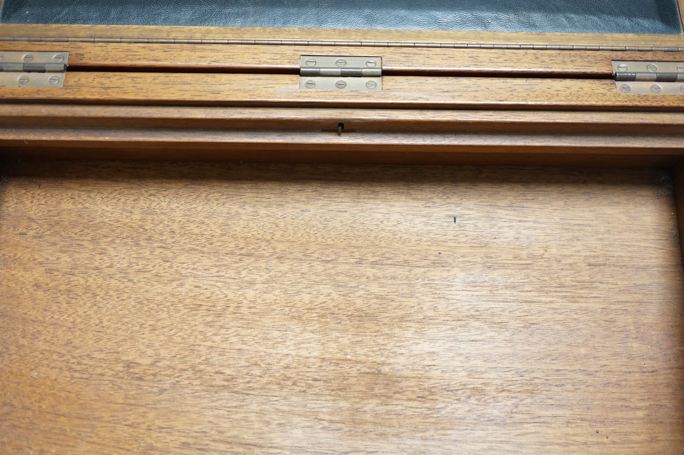 An inlaid mahogany writing slope with two silver-mounted inkwells, 39cm wide